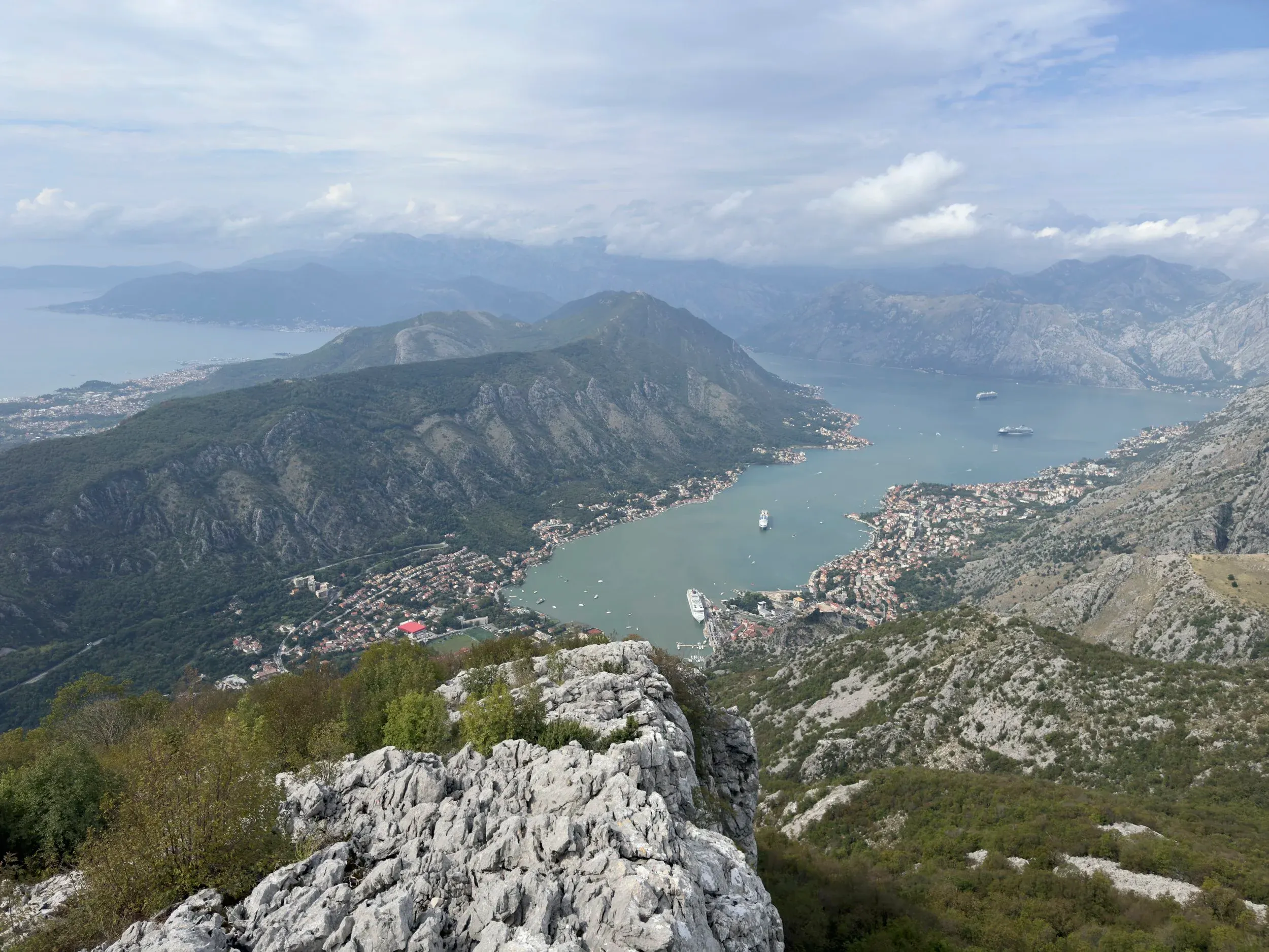 Stunning views of the Bay of Kotor. Old town of Kotor just below us on the right next to the docked cruise ship. The night before that we stayed at the very top left of the photo in the distant bay.