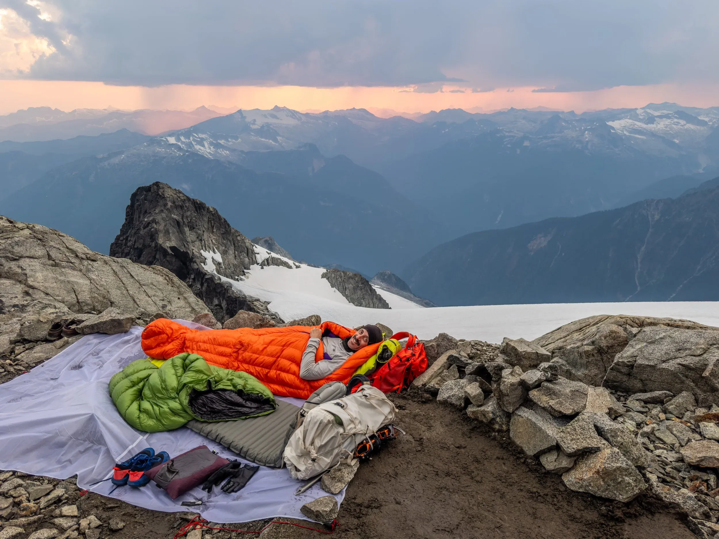 Rainclouds in the distance, but signs of lightning had abated, so we felt confident setting up our basic bivy and cooked dinner. After much deliberation we decided that the threat of rain dictated that we abandon this beautiful wind sheltered camp spot in favor of an adjacent rocky location where we could string up the tarp in case of rain.  The 3 hours of sleep the night before and 12 hours + 3100 metres of climbing that day meant that despite our exposed quarters, I slept solidly, even as Jem stumbled around in the middle of the night removing the noisy flapping tarp inches from my face after peeking out in the middle of the night to a clear sky of stars.