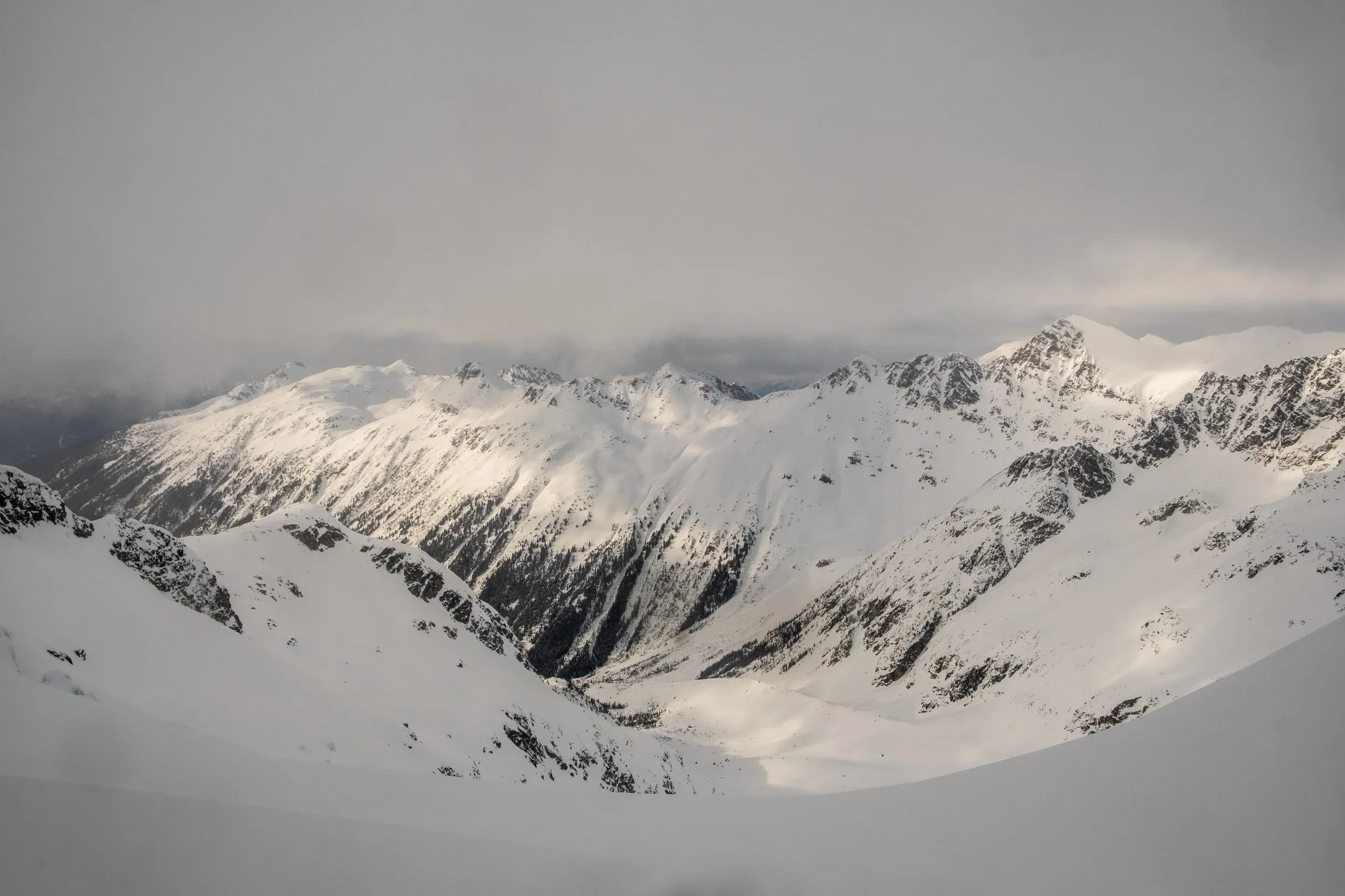 Looking back to the start of the journey from the Overlord Glacier, the far left on the ridge is Blackcomb. We had the best turns of the day here, with quality thigh deep powder on its sheltered North aspect. Mikey, in his exhaustion, somehow managed to forget one of his skins on his skiis for part of the descent!